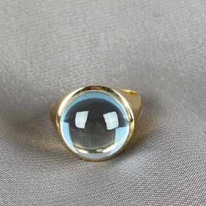 Sortija topacio sky cabujón 14 ct. Oro 18K.